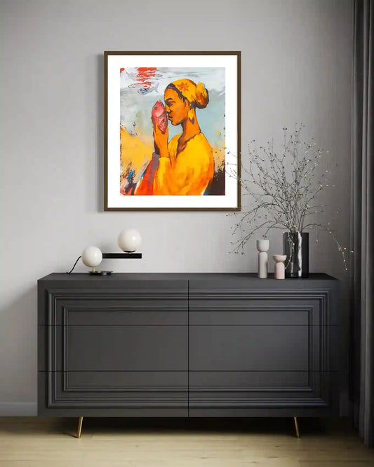 'Starring 3' by Bakri Moaz framed woman with fish art print displayed above dark gray sideboard with modern decor accessories