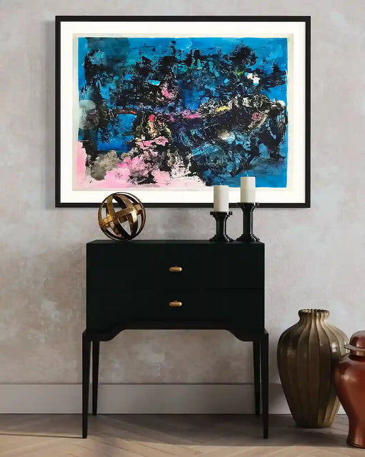 Catch The Moon painting by Samir Shareef in black frame above console with candles and gold sphere interior mockup