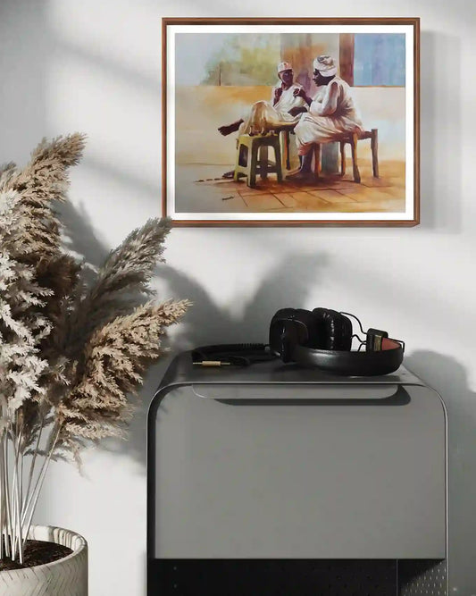 Coffee Break watercolor by Hussein Merghani in wooden frame mockup on white wall above desk with pampas grass wall art
