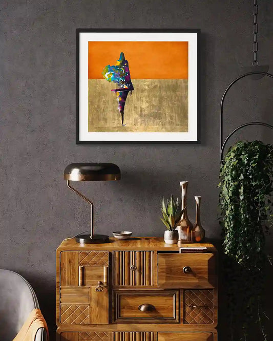 Cultural Grace digital art print displayed in black frame above wooden cabinet in modern interior home decor room setting