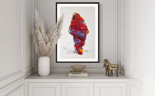 Daughters of the Nile 1 art print by Yasir Algrai displayed in black frame on white sideboard, elegant home decor mockup