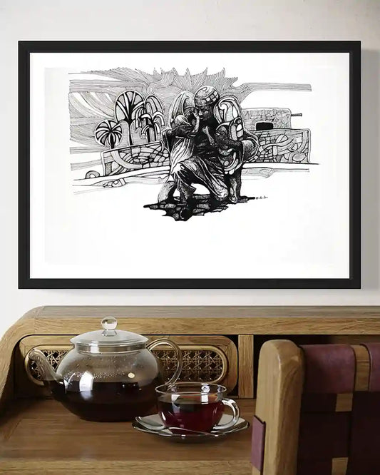 Father's Embrace framed art by Obada Gabir displayed above wooden tea table with glass teapot and traditional decor
