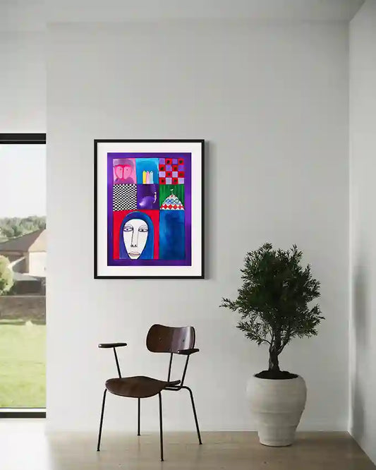 "Fragments of Identity 2" by Abushariaa Ahmed displayed in modern interior with wooden chair and potted plant