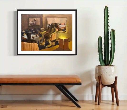 He is Calm and so am I art print by Yasmeen Abdullah displayed in black frame above leather bench with cactus plant