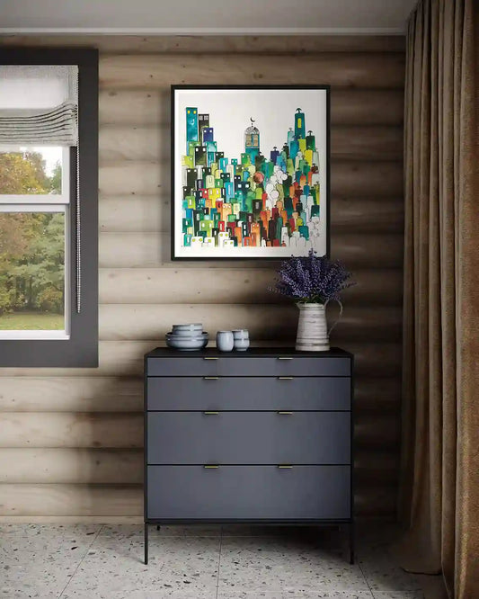 Hoolia by Gungalito framed cityscape print above dresser - colorful architectural art in modern rustic bedroom interior