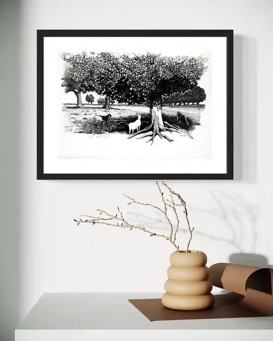 Pastoral Refuge framed ink painting by Obada Gabir displayed on wall above modern wooden shelf with decorative objects