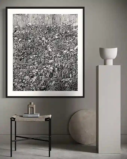 Framed "The Secret Garden of Ash" art print by Osman Gouma displayed above modern side table with minimalist ceramic vases