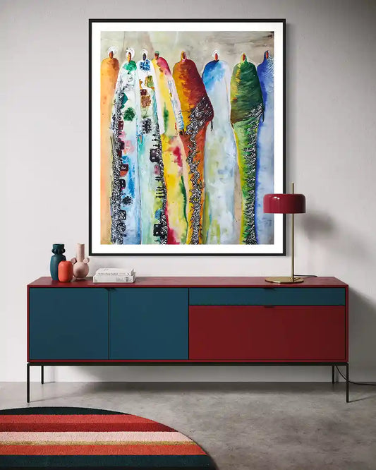 Supremes by Gungalito framed art print above modern sideboard, colorful watercolor cultural figures contemporary wall decor