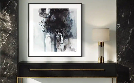 Framed "Through the Mist" art print by Abushariaa Ahmed displayed on console table with lamp in modern interior