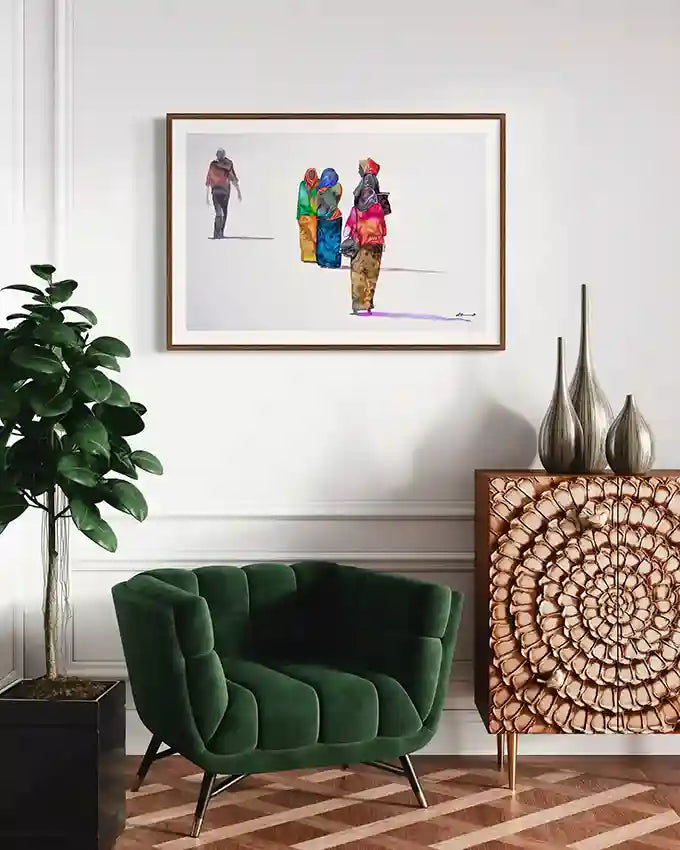 Modern living room with a green sofa, decorative cabinet, and framed artwork on the wall.