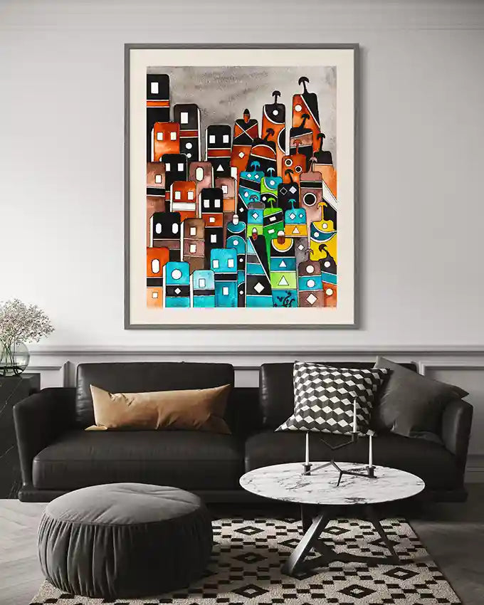 Ancient Tablets 3 framed art by Sudanese artist Yousif Ibrahim in Modern living room with a black sofa, round ottoman, in UAE