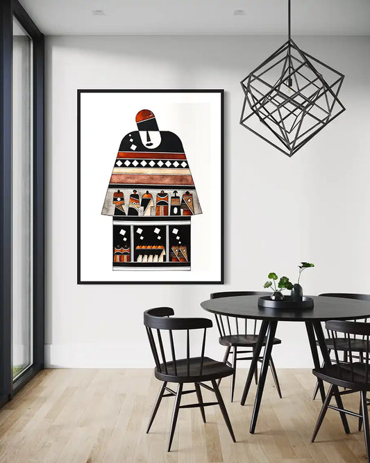 Dining room with a black table and chairs, framed art 'Armory' by Yousif ibrahim on the wall, and a modern pendant light. 