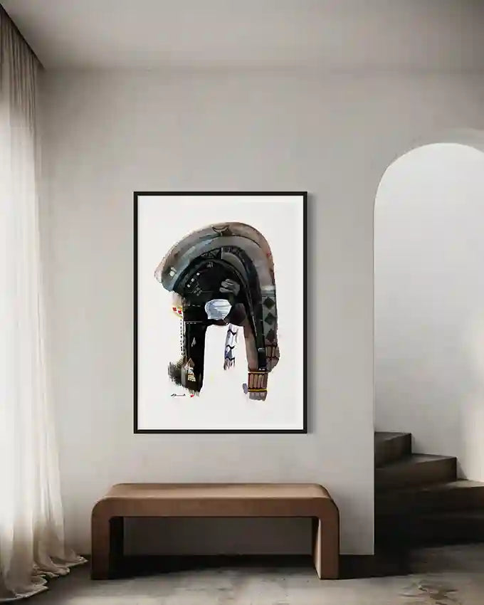 Framed art print by artist Galal Yousif on a wall in a room with a wooden bench and white curtains. in UAE