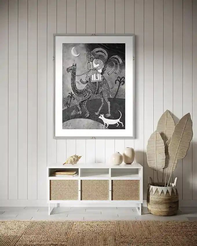 "The Midnight Traveler" art print above white console table with woven baskets and decorative wooden feathers.