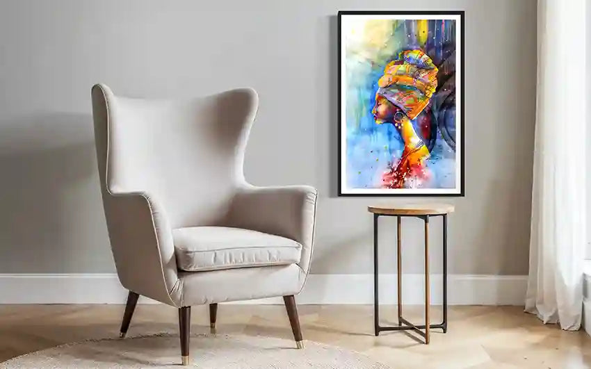 Colorful art print of African woman in headscarf by Galal Yousif, UAE. Beige armchair with vibrant wall painting backdrop