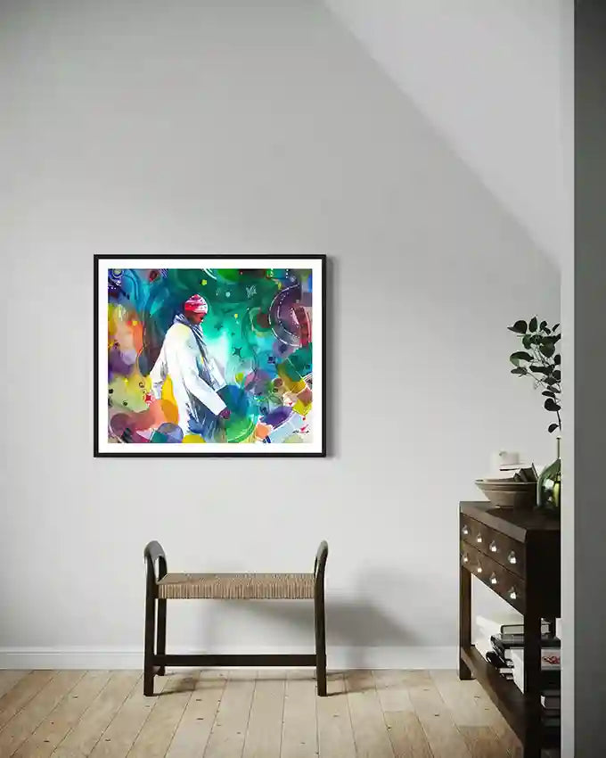 Colorful abstract Print by visual Sudanese artist Galal Yousif of a person on a white wall above a wooden bench.