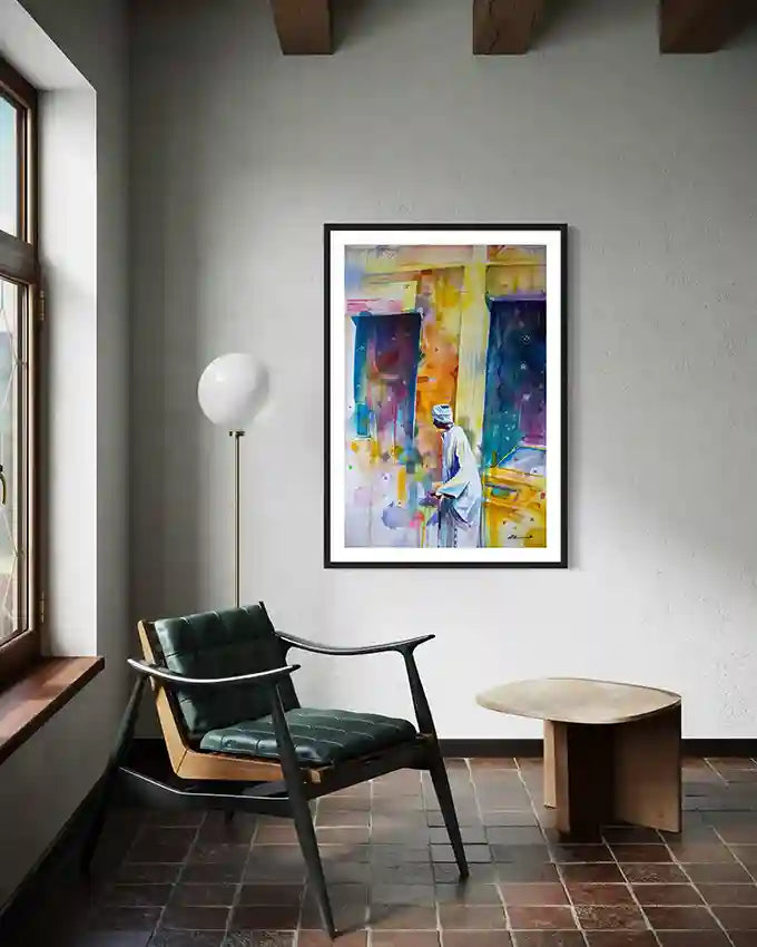 Modern interior with wooden ceiling, chair, table, and colorful abstract framed art print on the wall by artist Galal Yousif 