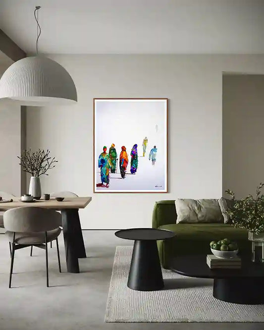 Modern living room with a colorful art print by visual artist galal yousif on the wall, green sofa, and dining table.