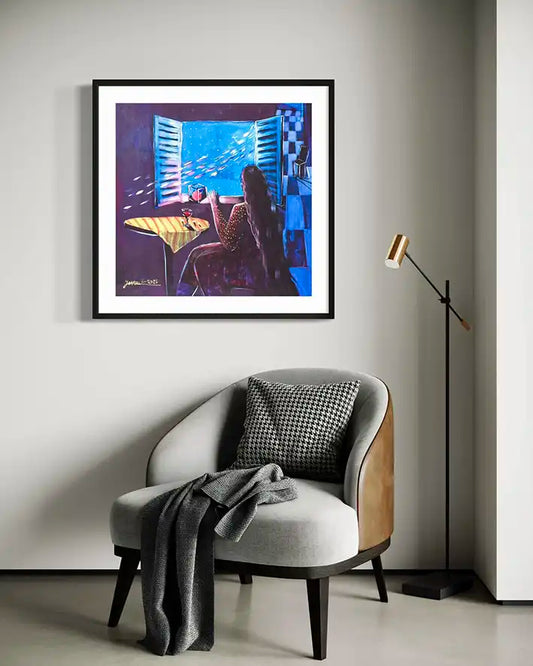 Blue Dawn art print by Yasmeen Abdullah displayed in black frame above modern grey armchair with floor lamp