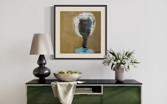 Citizen Unknown by Khalid Yan framed art print displayed above green sideboard with lamp and flowers in modern room setting