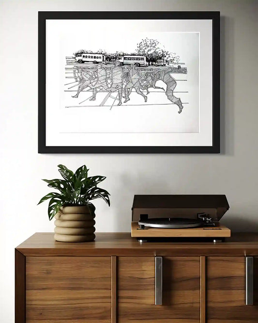 Crossing Shadows by Obada Gabir framed ink painting mockup on wall above sideboard - ghost figures with vehicles artwork