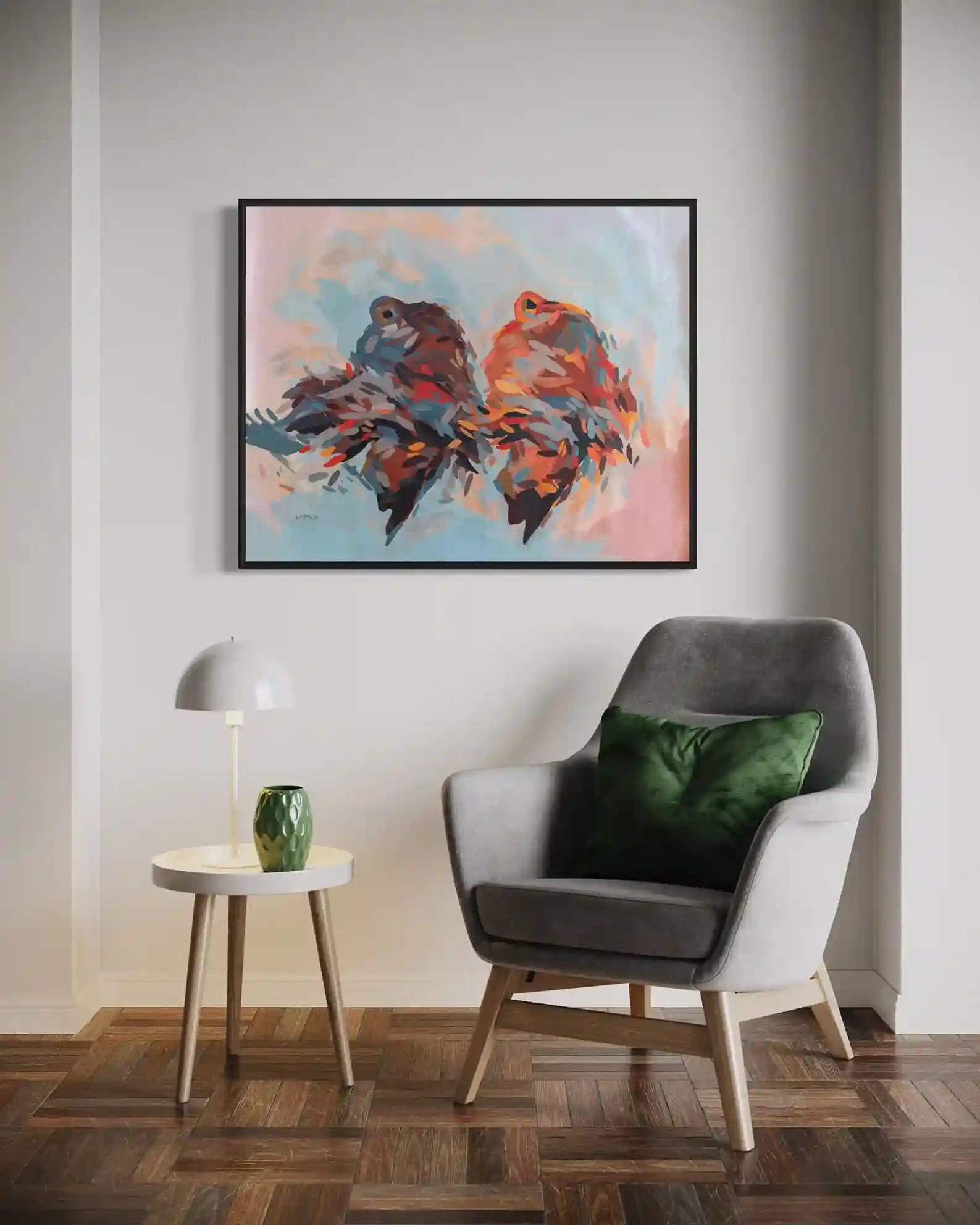 Daughters of the Nile by Khalid Yan framed art print displayed above gray chair with green pillow in modern living room