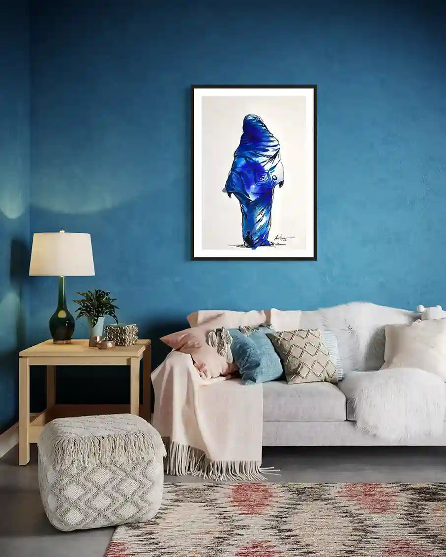 Daughters of the Nile 7 framed art print mockup by Yasir Algrai on blue wall above white sofa in modern living room