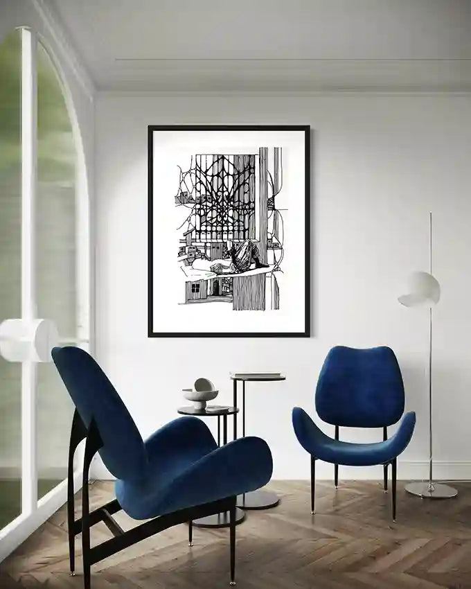Feed Your Mind art print by Obada Gabir in black frame displayed above blue modern chairs in minimalist living room