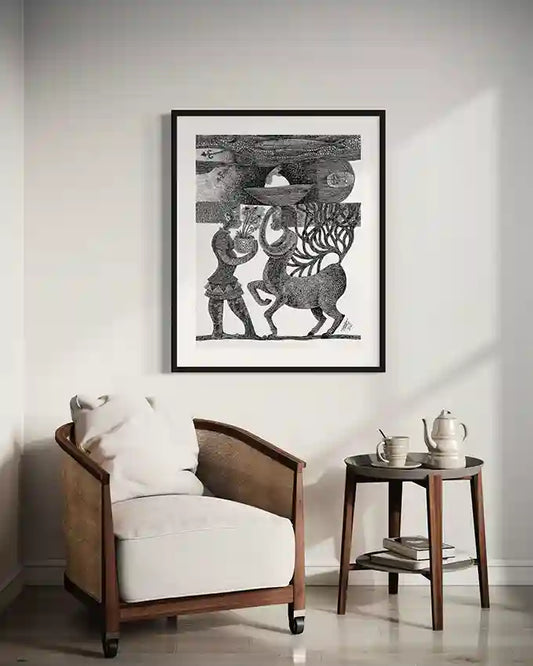 "The Forest Oracle" art print by Tariq Nasre displayed in cozy reading corner with wooden armchair and side table