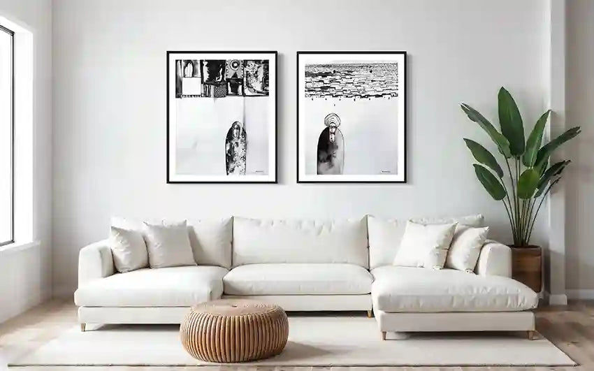 Black and white art prints by Abushariaa Ahmed displayed as gallery wall above white sectional sofa in modern living room mockup