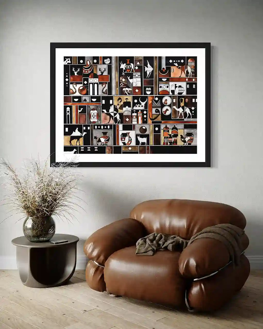 Glimpses art print by Gungalito in black frame with white mat displayed above brown leather armchair in modern living space.