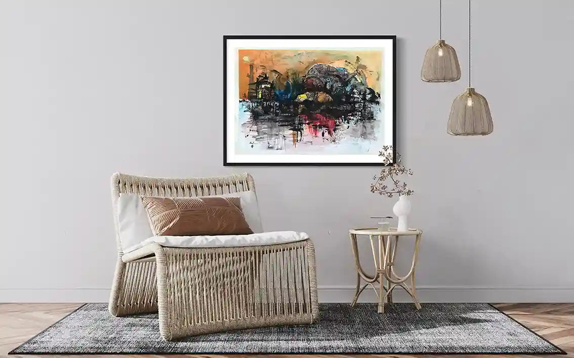 Heritage City painting by Samir Shareef in black frame above rattan chair in modern neutral living room interior mockup