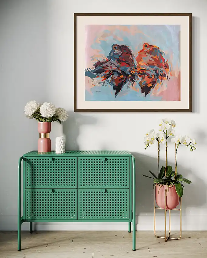 Daughters of the Nile abstract art print by Khalid Yan in wood frame above green console with flowers in elegant bedroom