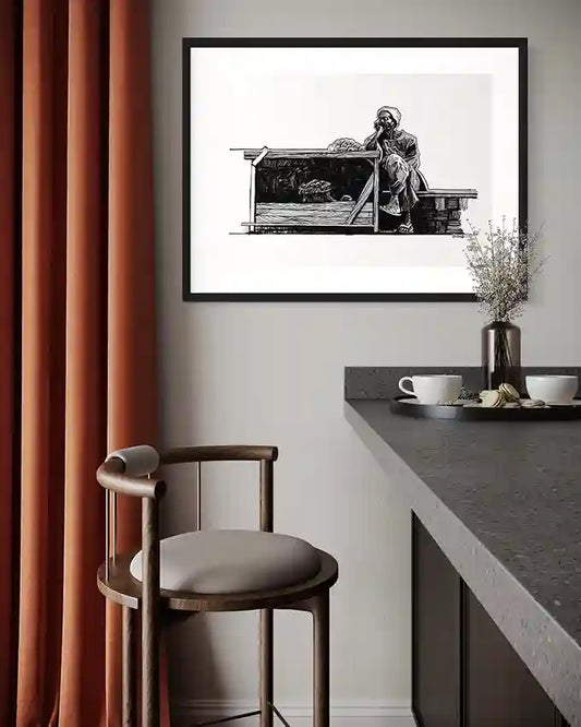 Obada Gabir vegetable seller pen and ink art print in black frame displayed above modern dining table with orange curtains and contemporary chair