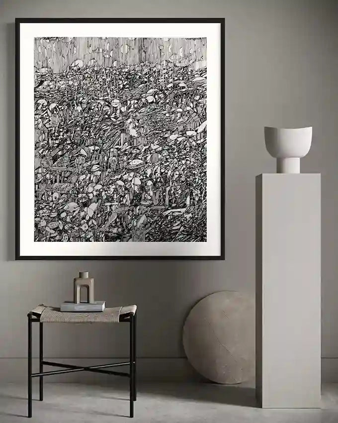 Framed "The Secret Garden of Ash" art print by Osman Gouma displayed above modern side table with minimalist ceramic vases