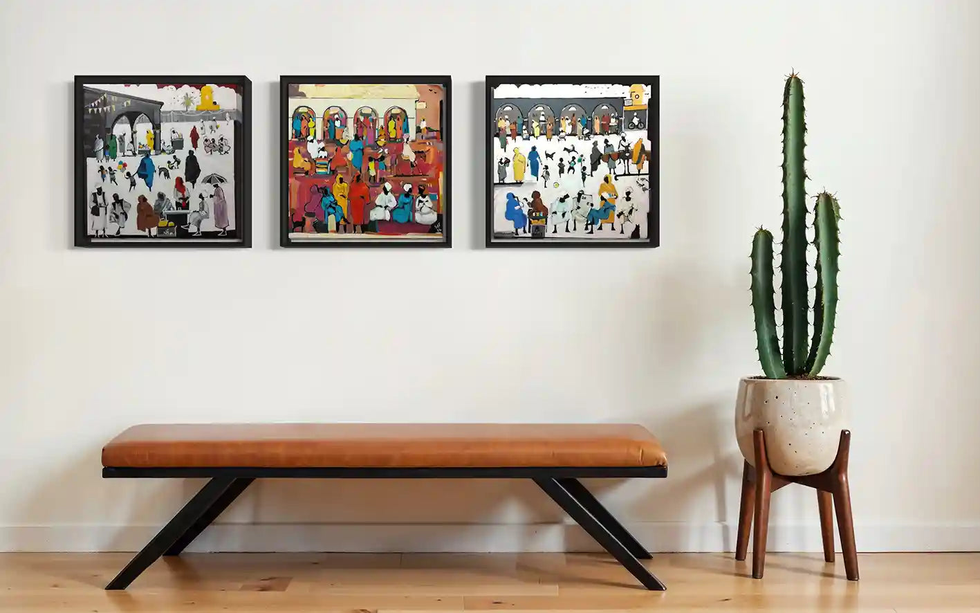 Souk Fragments 6, 7 and 8 framed paintings by Ahmed Alnahas displayed as triptych showing Sudanese market scenes on wall 