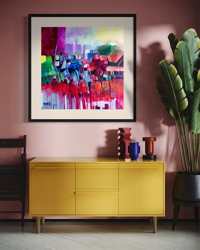 The Space Between Us art print by Rafat Omar in black frame on pink wall above yellow credenza with colorful vases