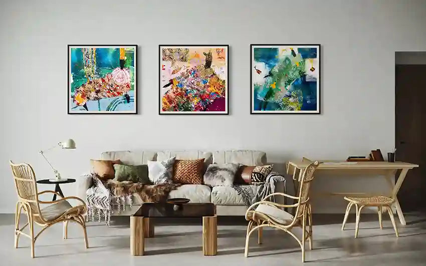 Sufi series three-piece art collection by Hani Khalil above bohemian sofa with rattan chairs & textured pillows - gallery wall