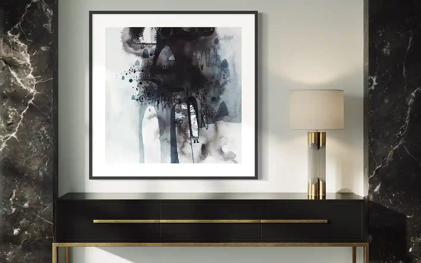 Framed "Through the Mist" art print by Abushariaa Ahmed displayed on console table with lamp in modern interior