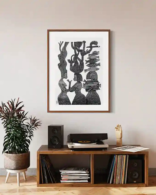 "The Tree Mothers" art print by Tariq Nasre displayed above wooden media console with turntable and vinyl records