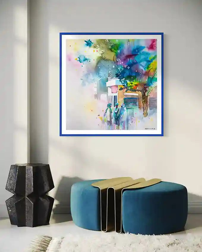 unwritten history print in a blue frame on a wall above a modern blue and gold ottoman.