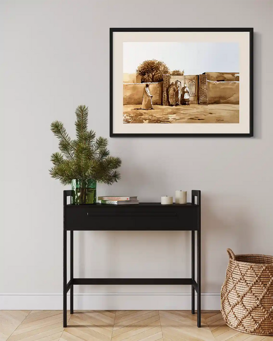 Coffee Chronicles: The Welcome Door art print mockup by Salih Abdo showing framed Sudanese family scene in modern interior